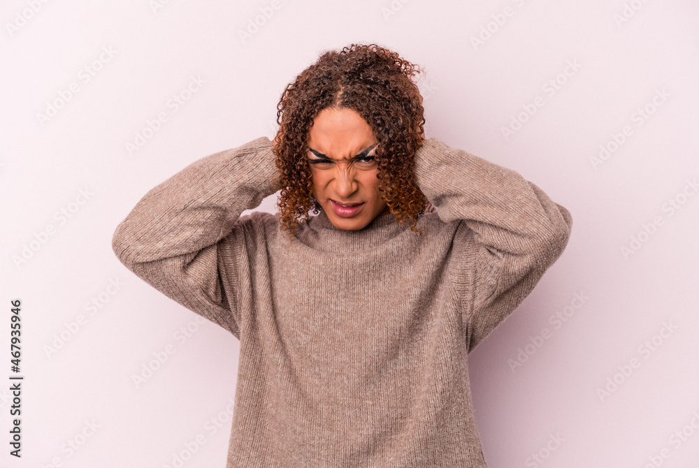 Young latin transsexual woman isolated on pink background covering ears with hands. Young latin transsexual woman isolated on pink background covering ears with hands.