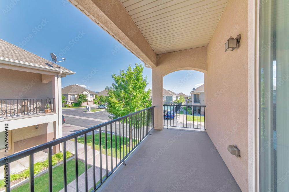 Terrace of a residential building with metal railing and concrete flooring