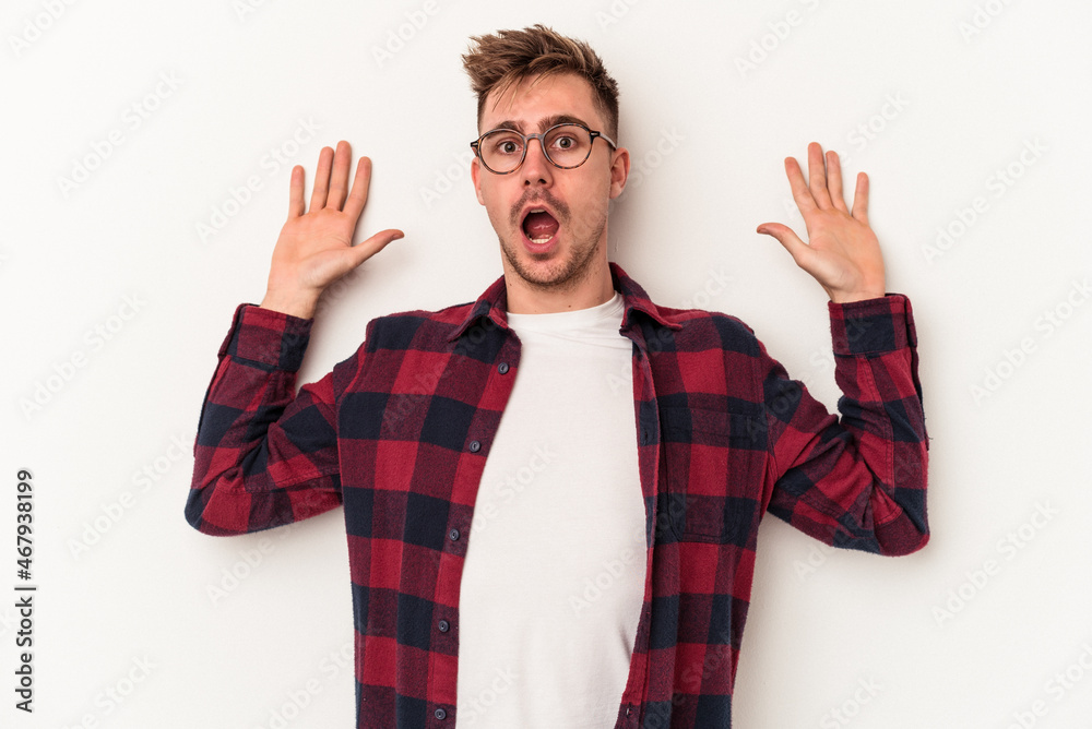 Young caucasian man isolated on white background being shocked due to an imminent danger Young caucasian man isolated on white background being shocked due to an imminent danger