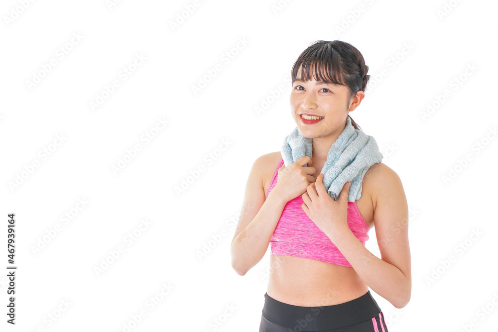 タオルで汗を拭く女性 タオルで汗を拭く女性