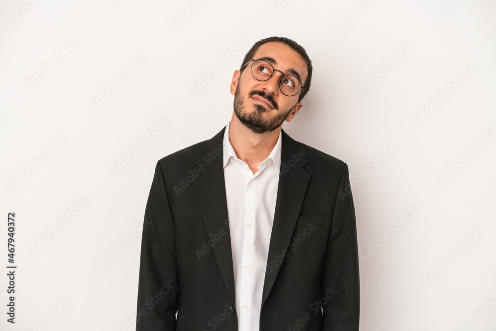 Young caucasian business man isolated on white background dreaming of achieving goals and purposes Young caucasian business man isolated on white background dreaming of achieving goals and purposes