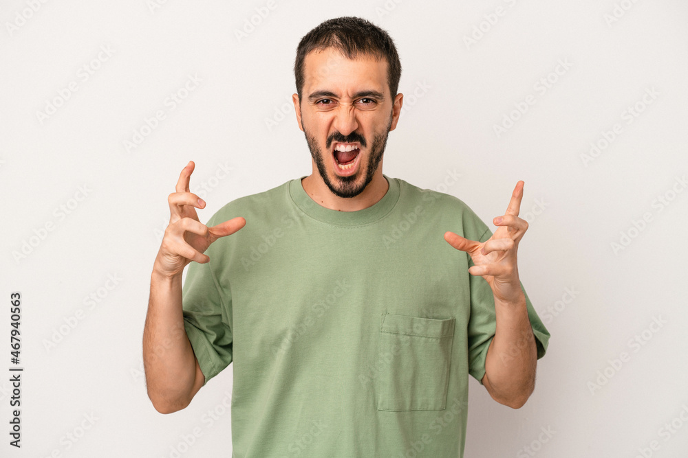 Young caucasian man isolated on white background screaming with rage. Young caucasian man isolated on white background screaming with rage.