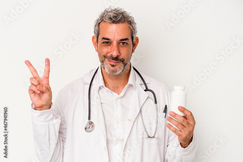 Middle age doctor caucasian man isolated on white background showing number two with fingers.