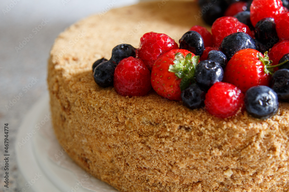 Cake decorated with fresh berries. Honey cake. Cake decorated with fresh berries. Honey cake.