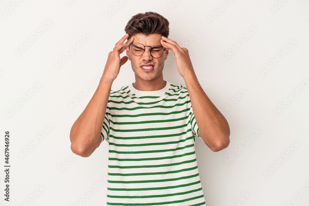 Young caucasian man isolated on white background touching temples and having headache. Young caucasian man isolated on white background touching temples and having headache.