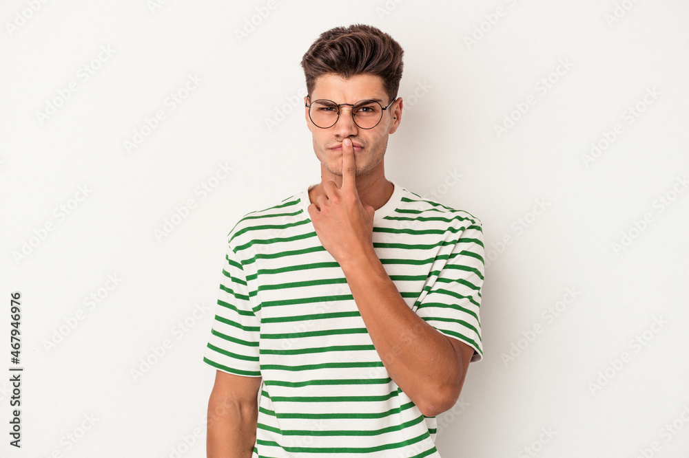 Young caucasian man isolated on white background thinking and looking up, being reflective, contemplating, having a fantasy. Young caucasian man isolated on white background thinking and looking up, being reflective, contemplating, having a fantasy.