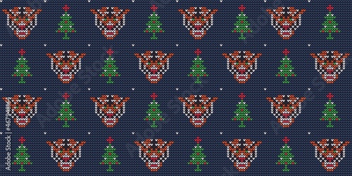 Knit ornament with tiger and Christmas tree. Christmas knitted seamless pattern. Vector illustration.