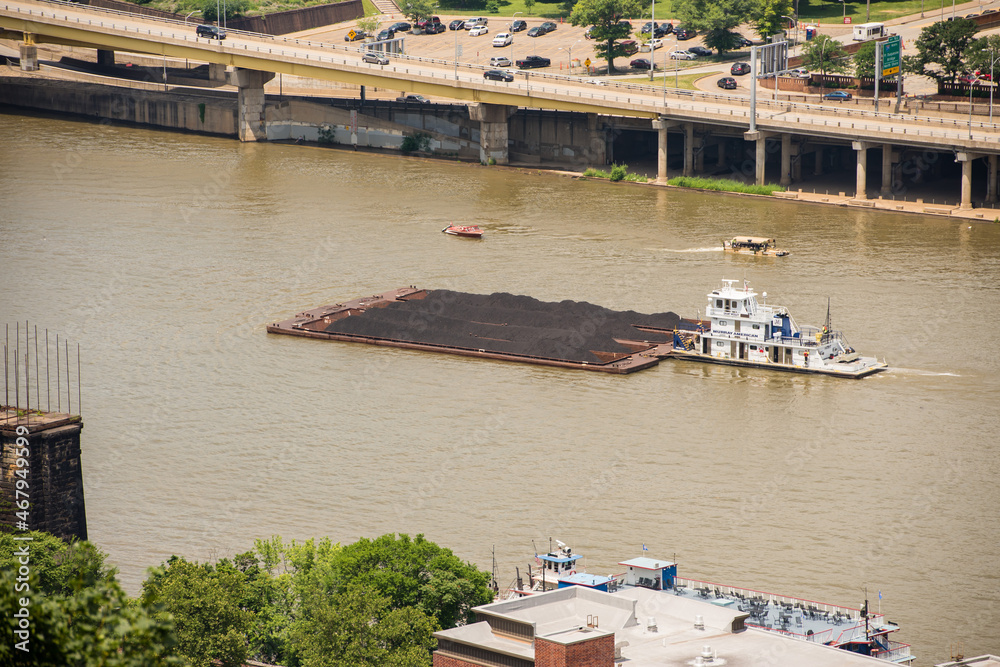 Barge on muddy river in Pittsburgh PA