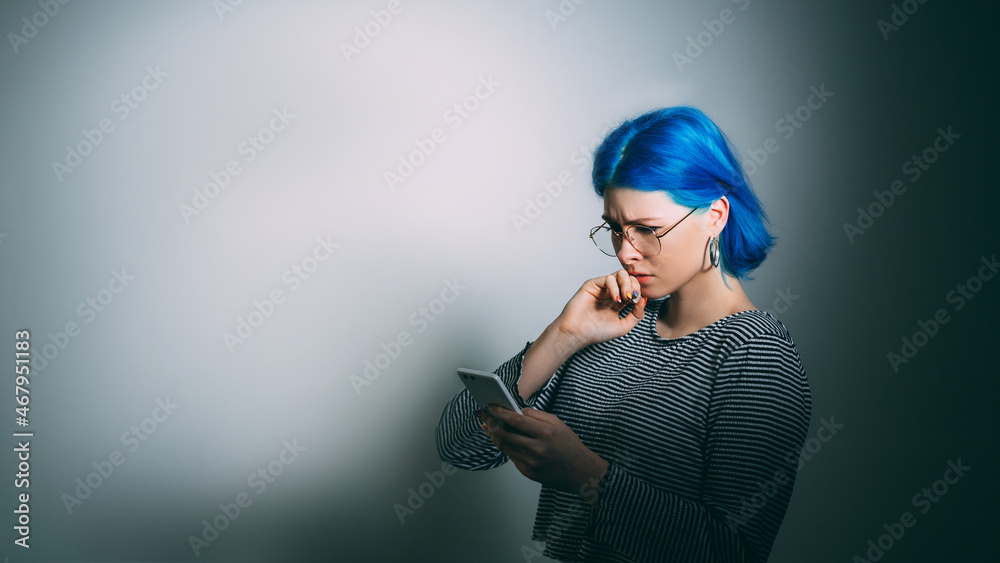 © golubovy - Cyber bullying. Bad news. Internet harassment. Sad depressed woman victim received phone hater abuse message isolated on light gradient empty space background.