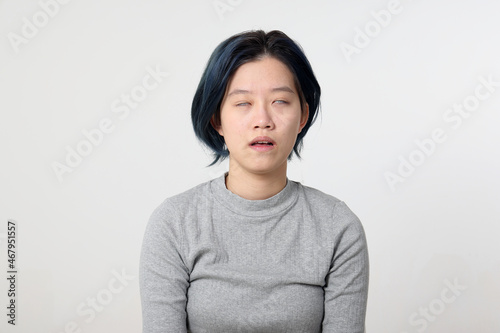 Young attractive Asian chinese malay woman pose face body expression mode emotion on white background relived ignore