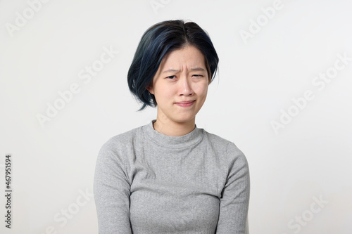 Young attractive Asian chinese malay woman pose face body expression mode emotion on white background look curious
