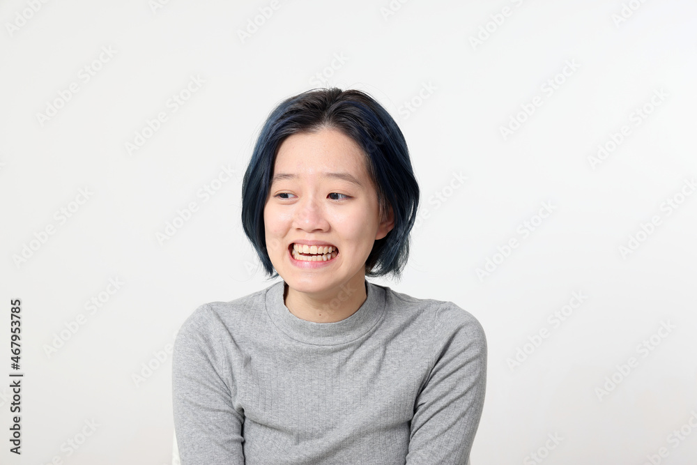 Young attractive Asian chinese malay woman pose face body expression mode emotion on white background laugh smile happy Young attractive Asian chinese malay woman pose face body expression mode emotion on white background laugh smile happy