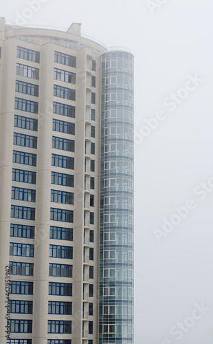 Apartment house. Construction of a multi-storey building. A skyscraper in the fog. Foggy weather.