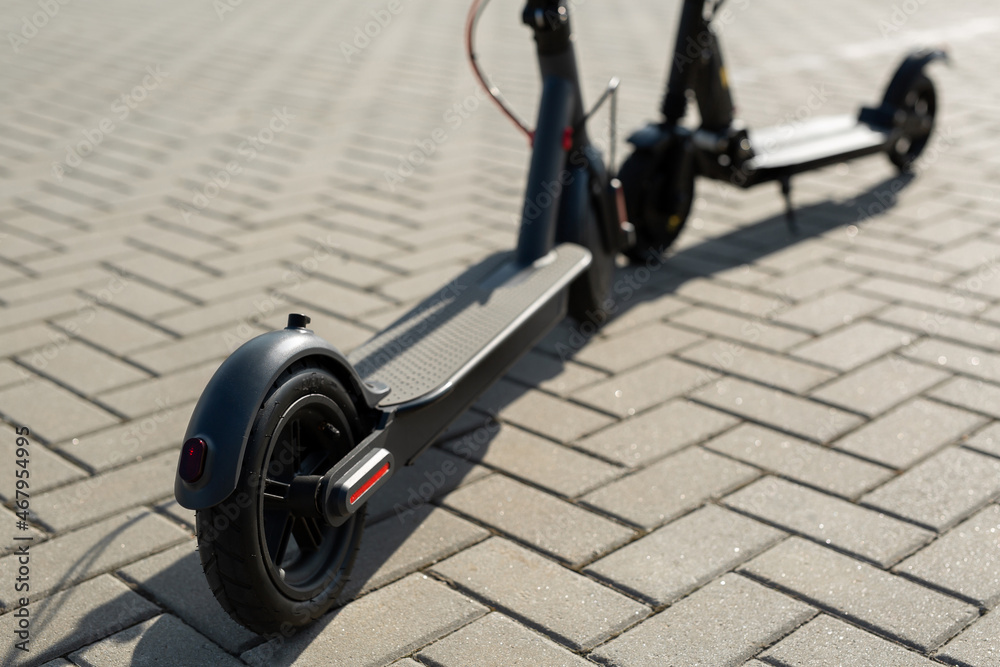 Modern electric scooters parking on the street