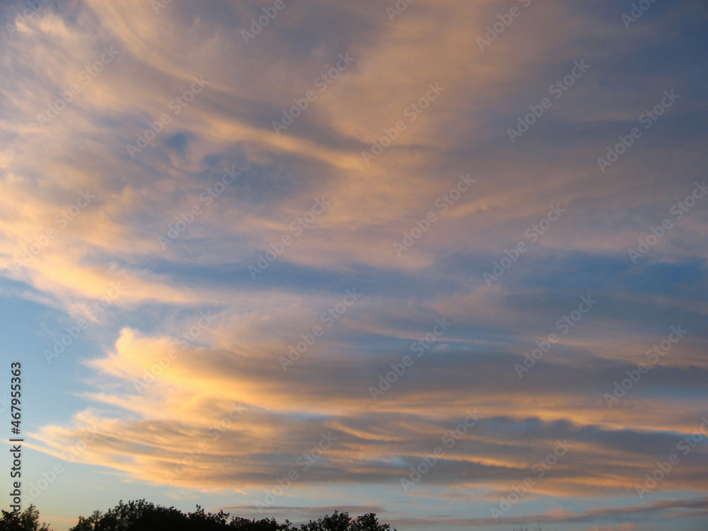 Beautiful evening sky with orange clouds at sunset