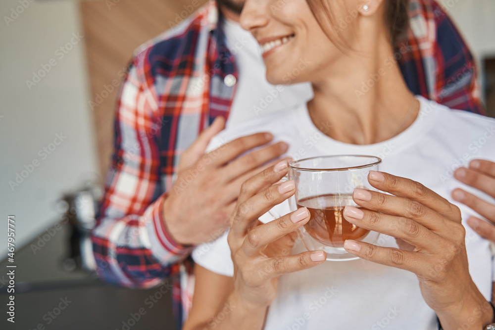 Man hugging his girlfriend in home apartments Man hugging his girlfriend in home apartments