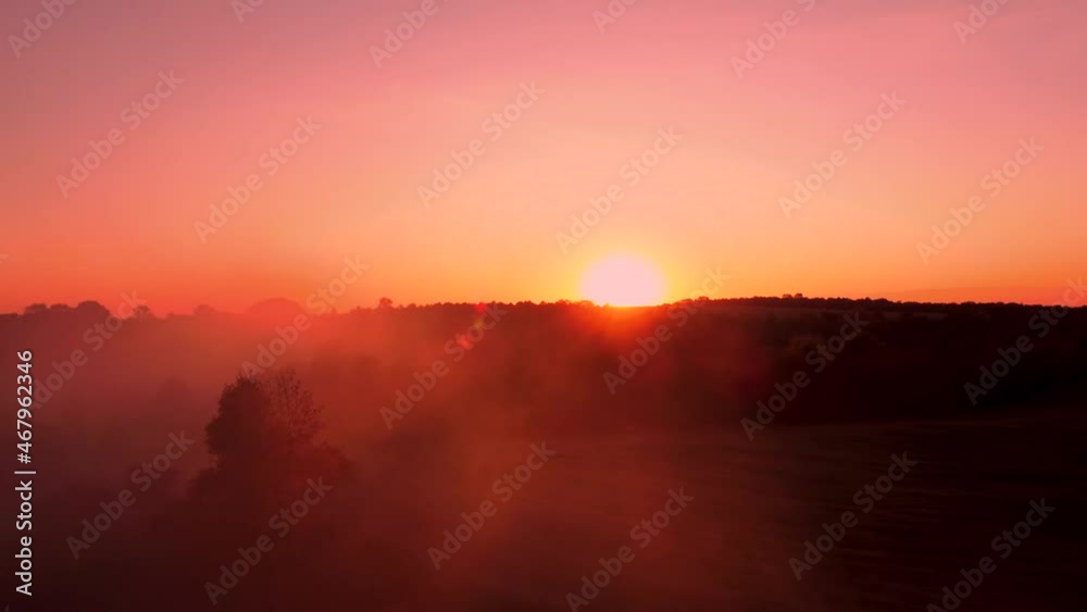 Autumn in the village. Ukrainian village in autumn from a bird's eye view. Aerial photography of the Ukrainian village. Garbage smoking season in the villages. sunset through the smoke screen Autumn in the village. Ukrainian village in autumn from a bird's eye view. Aerial photography of the Ukrainian village. Garbage smoking season in the villages. sunset through the smoke screen