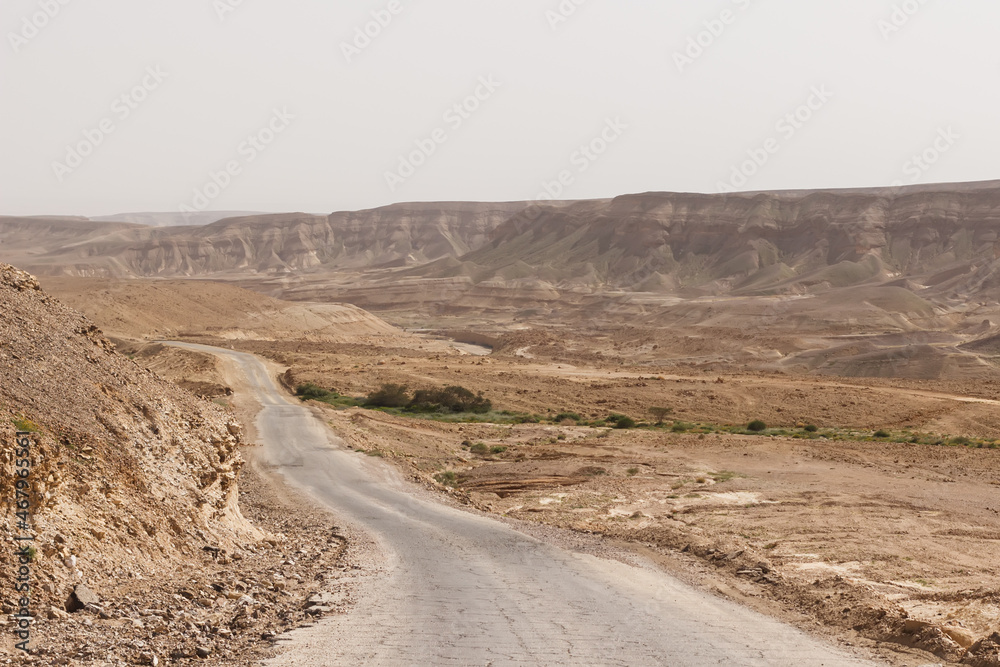 Road through hills and cliffs in the Judean Desert in Israel Road through hills and cliffs in the Judean Desert in Israel