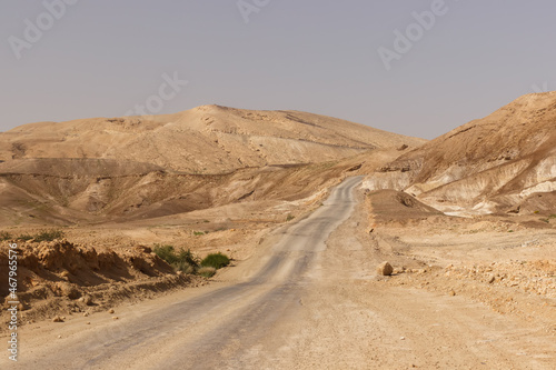 Road through hills and cliffs in the Judean Desert in Israel