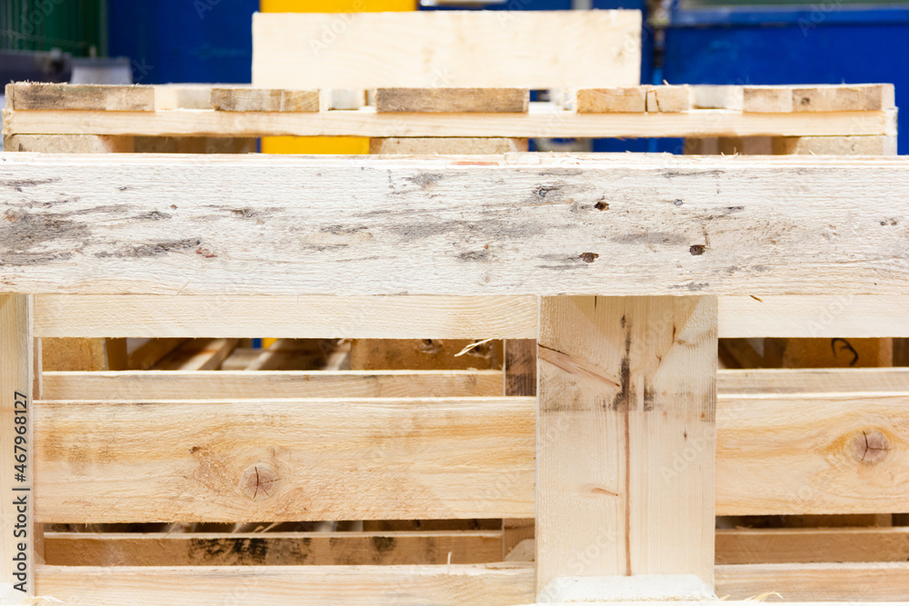 Industrial wooden pallets in factory. Logistics supply concept