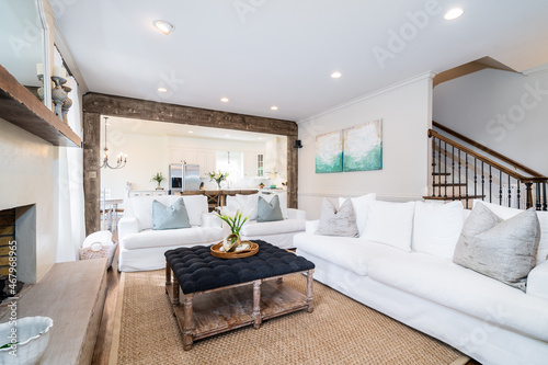 Cozy white sofa set with contrasting ottoman