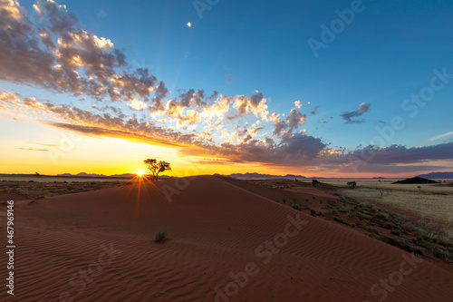 Yellow sunset and clouds at the dune in Namib Desert