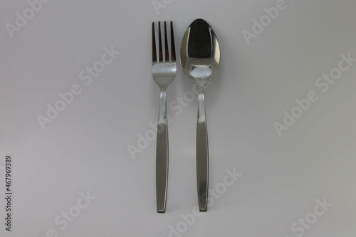 Spoon and fork stainless steel isolated on white background closeup.