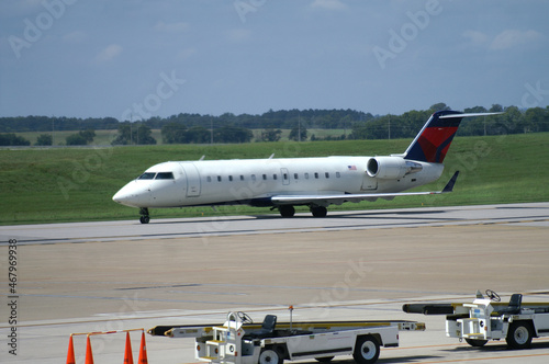 Airplane Rolling on Runway at Airport