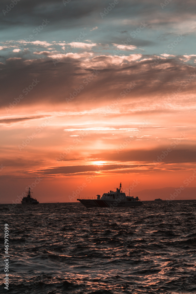 sunset over the sea gulf of Izmir ships