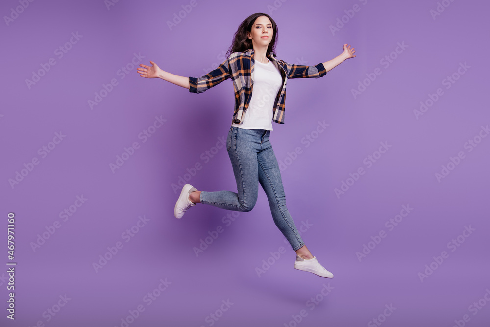 Full length photo of young attractive girl happy positive smile jump up fly air isolated over violet color background
