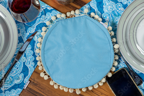 blue tortillero with christmas decoration on a table for christmas dinner photo