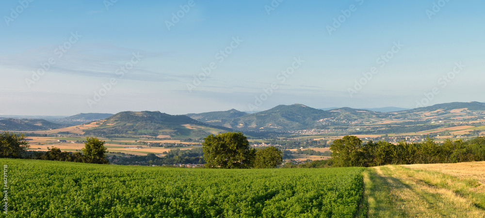 A beautiful viewpoint with a volcanic mountains landscape at the horizon.