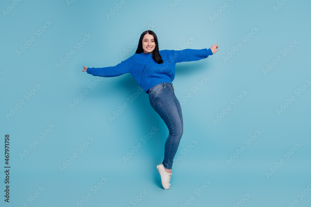 Full size profile side photo of young cheerful girl dancing have fun disco music isolated on blue colored background