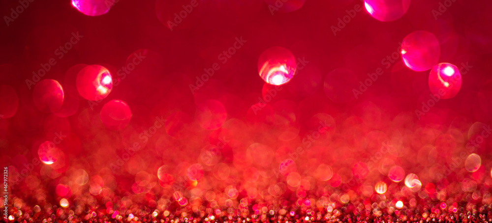 Red Christmas lights background, banner design. Shiny glowing surface with bokeh, abstract defocused glitter with sparkles Red Christmas lights background, banner design. Shiny glowing surface with bokeh, abstract defocused glitter with sparkles