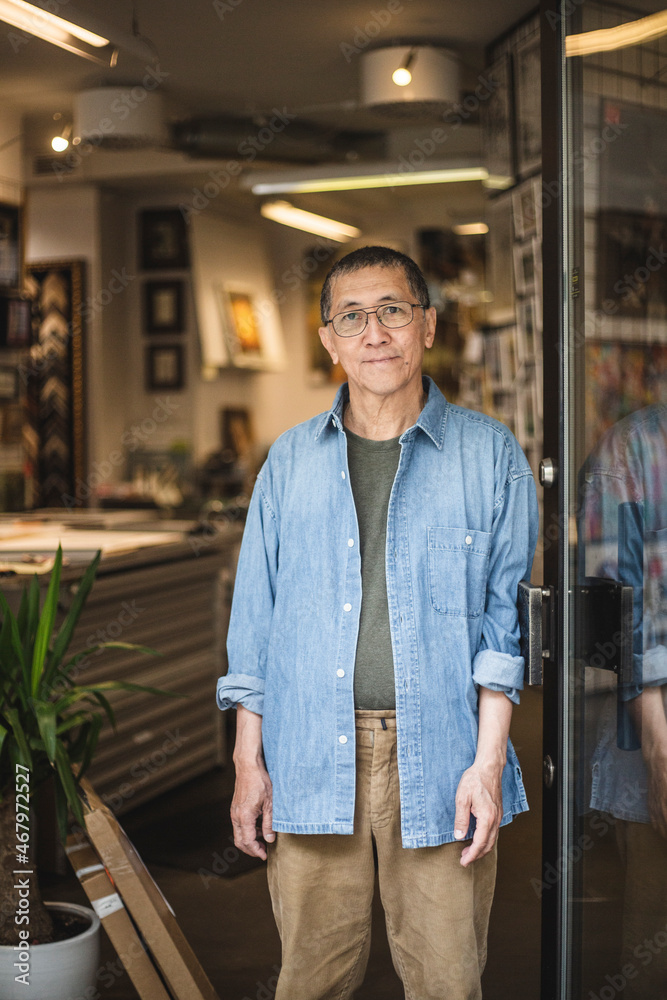 Male owner standing by door at workshop Male owner standing by door at workshop