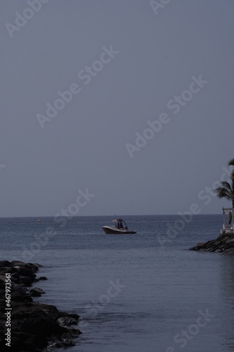A boat corssing the sea photo