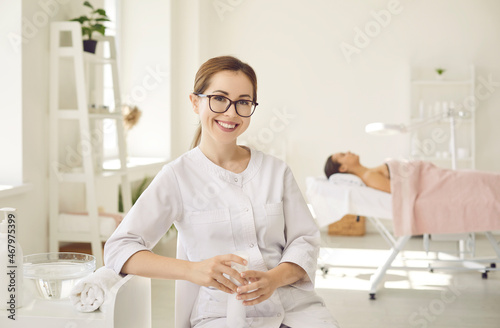 Canvas Print Portrait of happy young female dermatologist, skin therapist, beautician and skincare professional at work