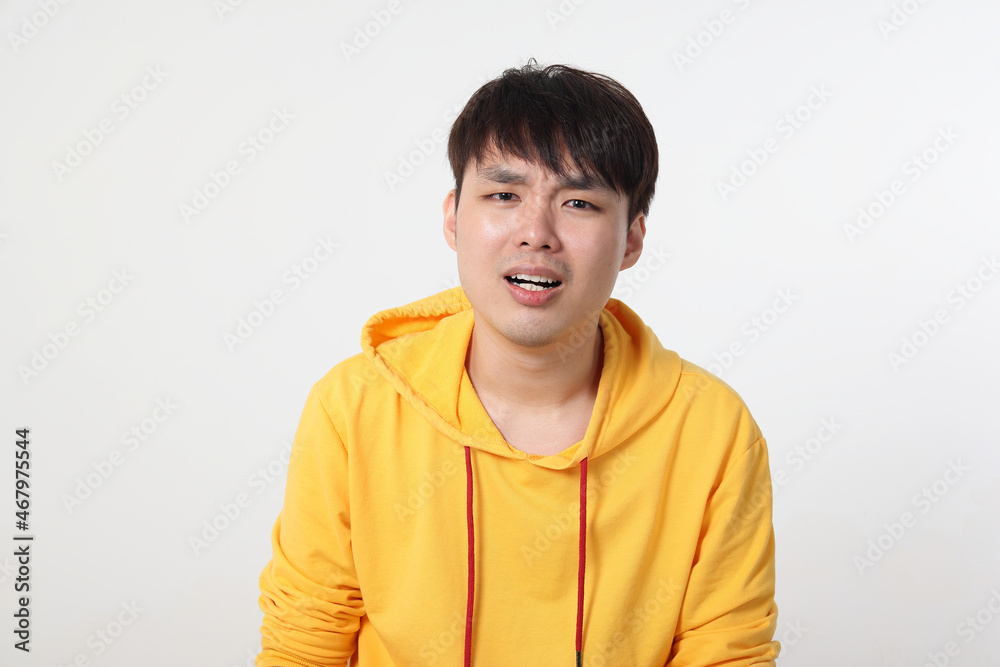 Young good looking Asian chinese malay man pose face body expression mode emotion on white background sad shocked mouth open Young good looking Asian chinese malay man pose face body expression mode emotion on white background sad shocked mouth open