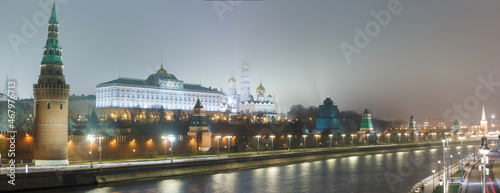 Moscow, Russia.  Night panoramic view of The Kremlin: embankment, towers, temples, Great Kremlin palace. November, foggy weather. © olegkliucharev