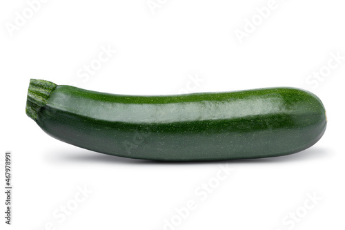Single fresh green whole zucchini isolated on white background