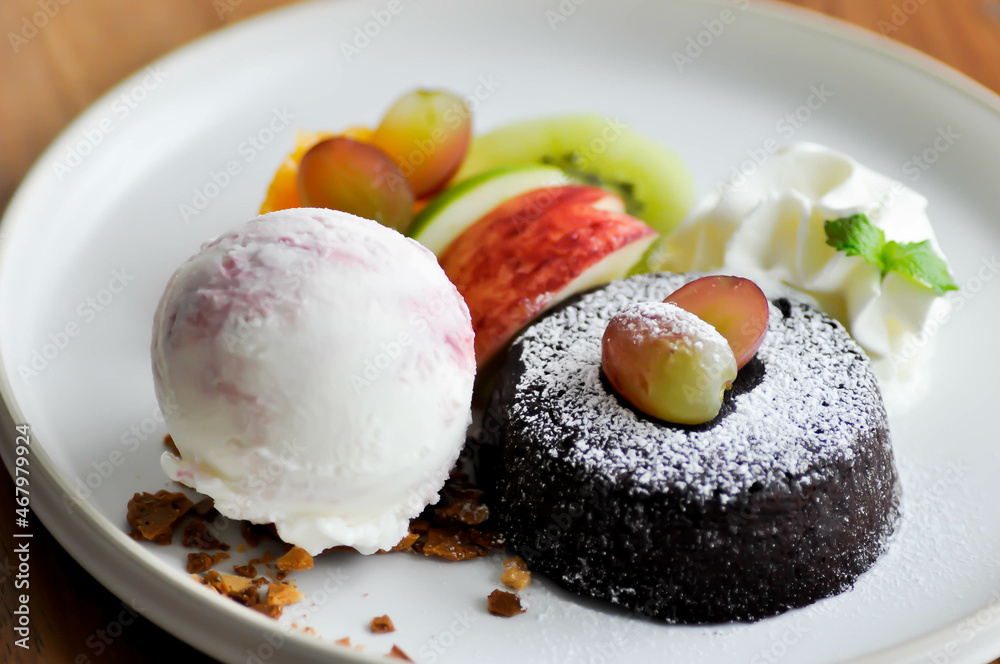 chocolate cake or chocolate lava cake with ice cream and fruit chocolate cake or chocolate lava cake with ice cream and fruit