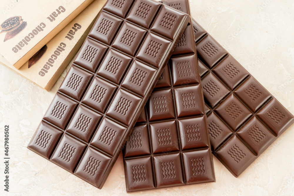 Handmade chocolate. Black bitter craft chocolate on white background. Healthy food concept, delicious chocolate sweets, diet, sugar Handmade chocolate. Black bitter craft chocolate on white background. Healthy food concept, delicious chocolate sweets, diet, sugar