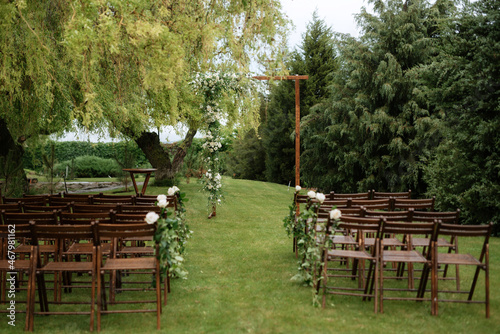 wedding ceremony area with dried flowers in a meadow in a forest photo