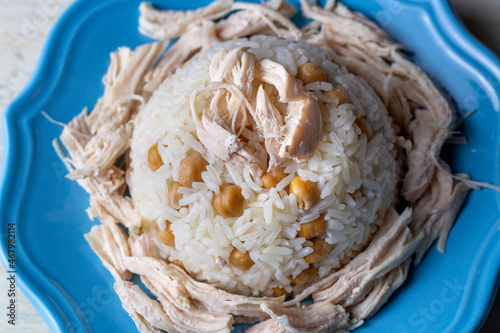 Traditional delicious Turkish food; Rice with chickpeas and chicken (Turkish name; Tavuklu nohutlu pilav or pilaf) photo