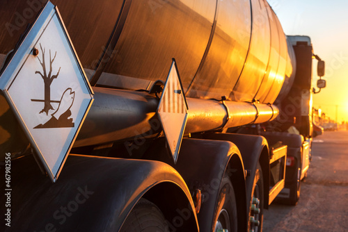 Contamination hazard labels on a tanker truck for the transport of dangerous goods. photo