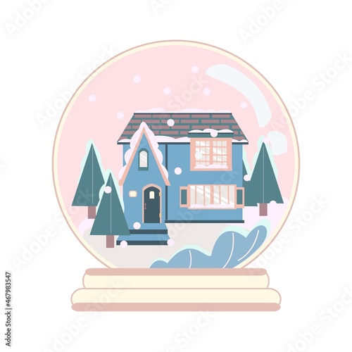 Cottage and chrictmas tree in snow globe.