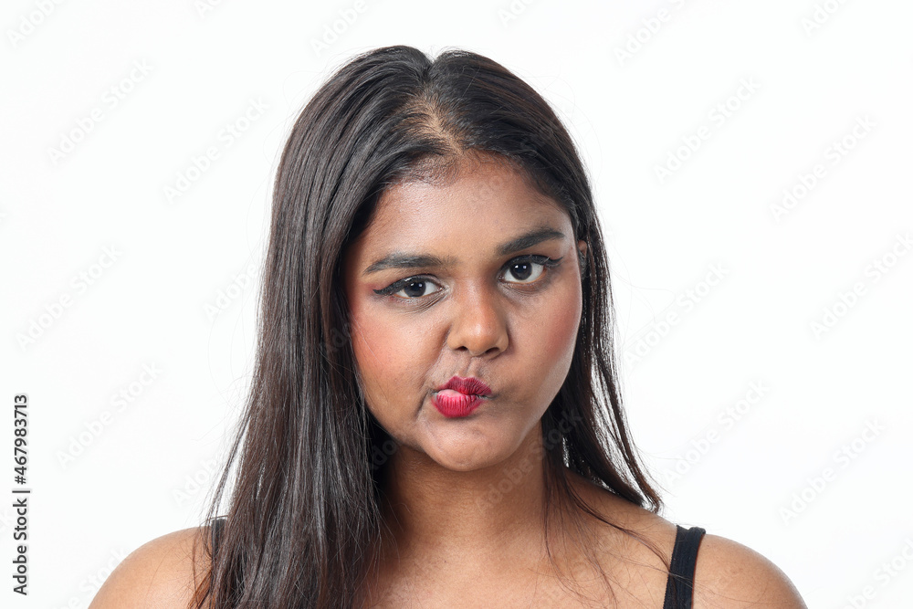 Young attractive Asian Indian woman pose face body expression mode emotion on white background lips twist wicked Young attractive Asian Indian woman pose face body expression mode emotion on white background lips twist wicked