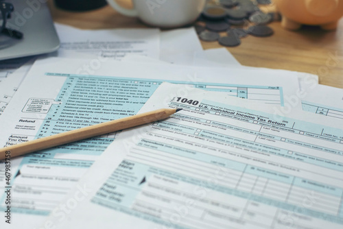 Individual Income Tax Return Form and calculator For who have income According to United States law. This is the season that has to pay and deadline for tax payment. Planning Budget and Tax Concept. photo