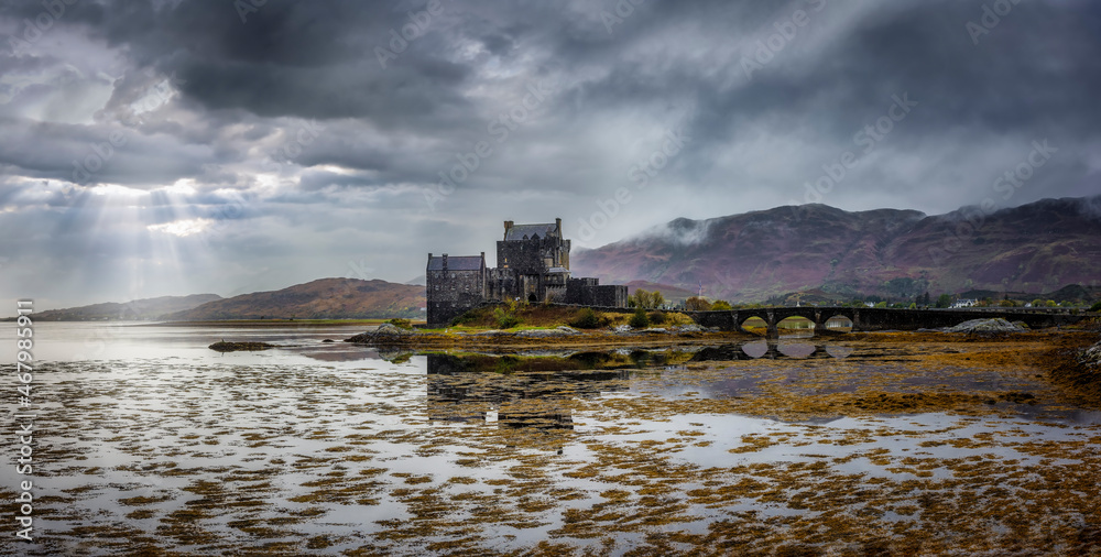 Panorama of the famous Eilean Donan Castle on a wet and foggy autumn day in Scotland