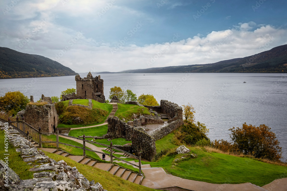 Panoramic view of the Urquhart Castle at Loch Ness during golden autumn time without people, Scotland Panoramic view of the Urquhart Castle at Loch Ness during golden autumn time without people, Scotland